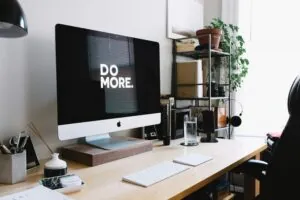 Maximize your productivity with a well-organized workspace and a motivational reminder to 'Do More' every day.