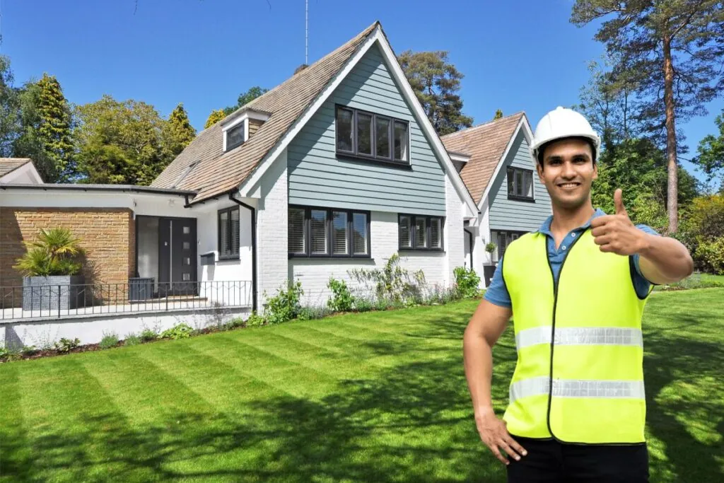 contractor thumbs up near modern house exterior