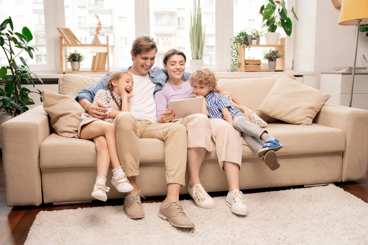 family relaxing on couch in living room